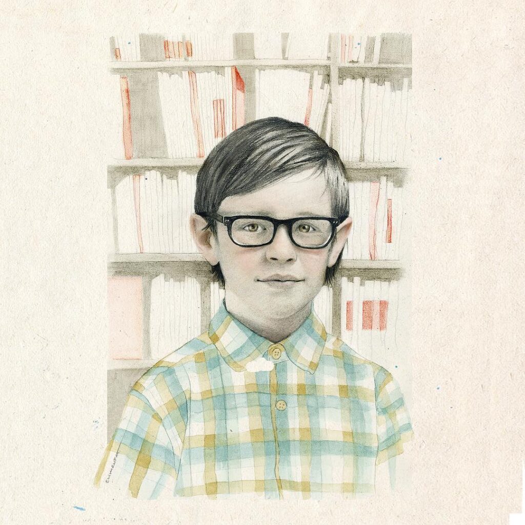 Niño gafitas biblioteca